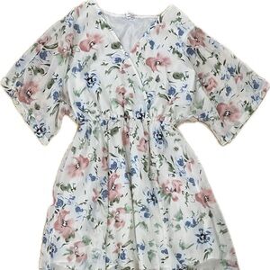 White and floral maxi dress with tie around belt that matches.